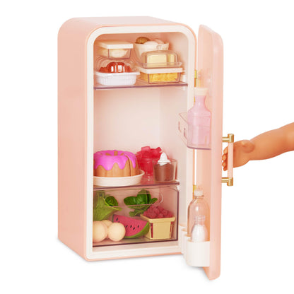 Our Generation pink mini fridge for dolls with play food accessories, designed for realistic play and imaginative fun.