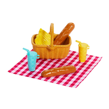 Barbie Family & Friends Picnic Playset with small dolls, fashion accessories, and food pieces for outdoor role-play fun.