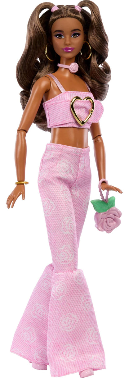 Barbie Deluxe Style Doll #12 in pink denim crop top and rose print flare jeans with wavy brown hair and accessories.