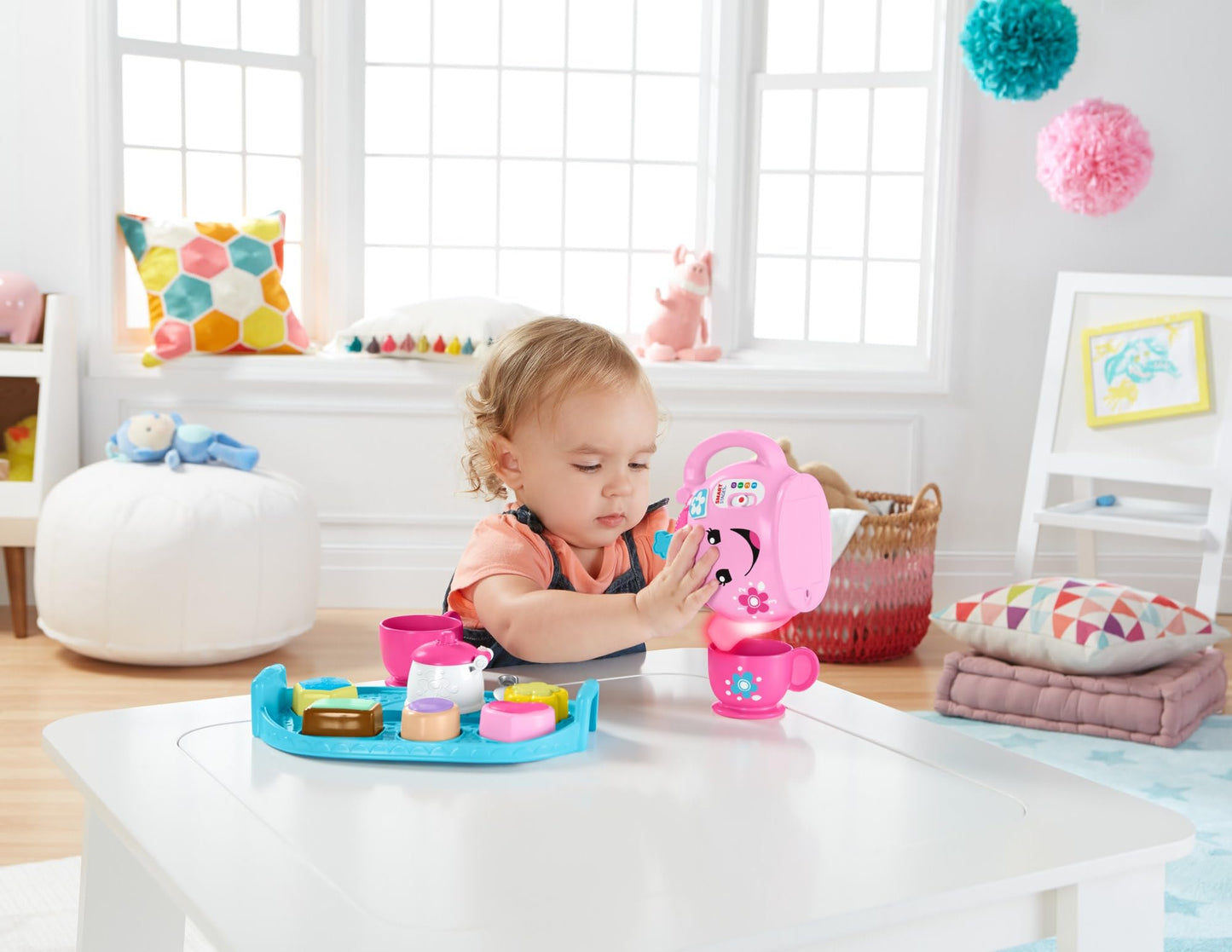 Fisher-Price Laugh & Learn Sweet Manners Tea Set for toddlers, featuring colorful cups, teapot, and playful lights and sounds.