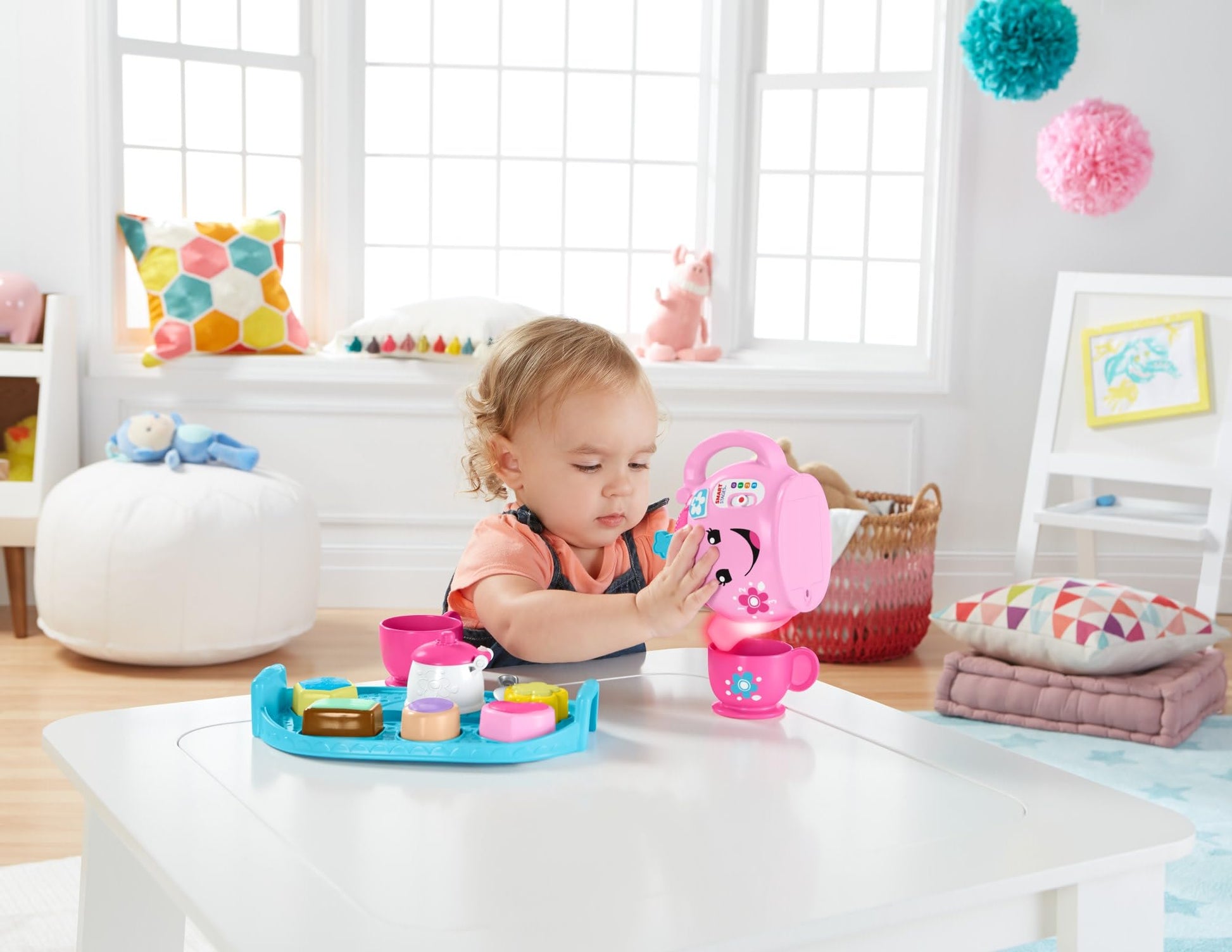 Fisher-Price Laugh & Learn Sweet Manners Tea Set for toddlers, featuring colorful cups, teapot, and playful lights and sounds.