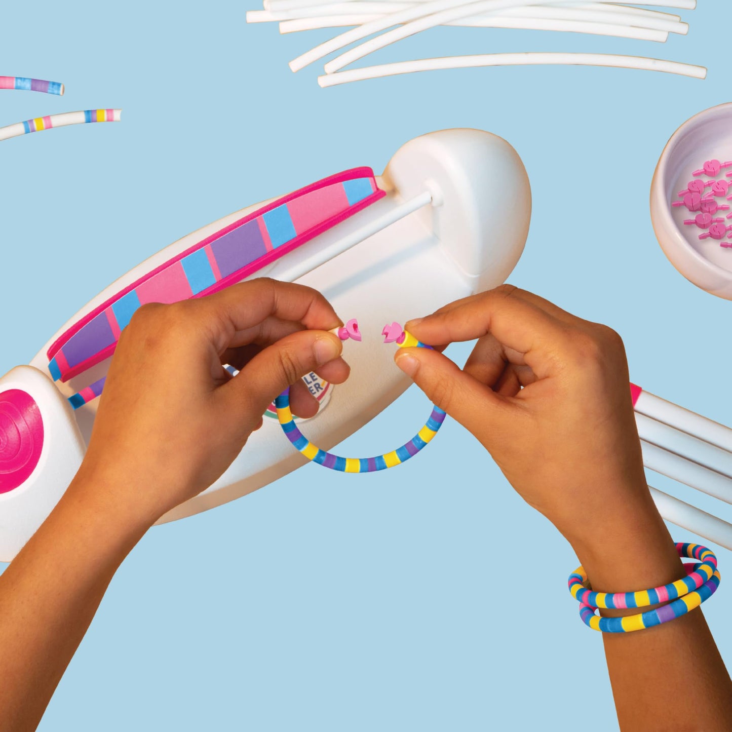 FabLab Colour Spin Bracelet Maker kit showing colorful bracelet designs with vibrant beads, ideal for kids' jewelry making.