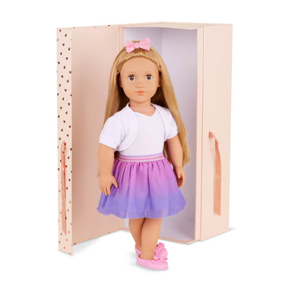18-inch Our Generation doll Thea with blond hair, hazel eyes, bow-themed outfits, and styling accessories in a gift box.