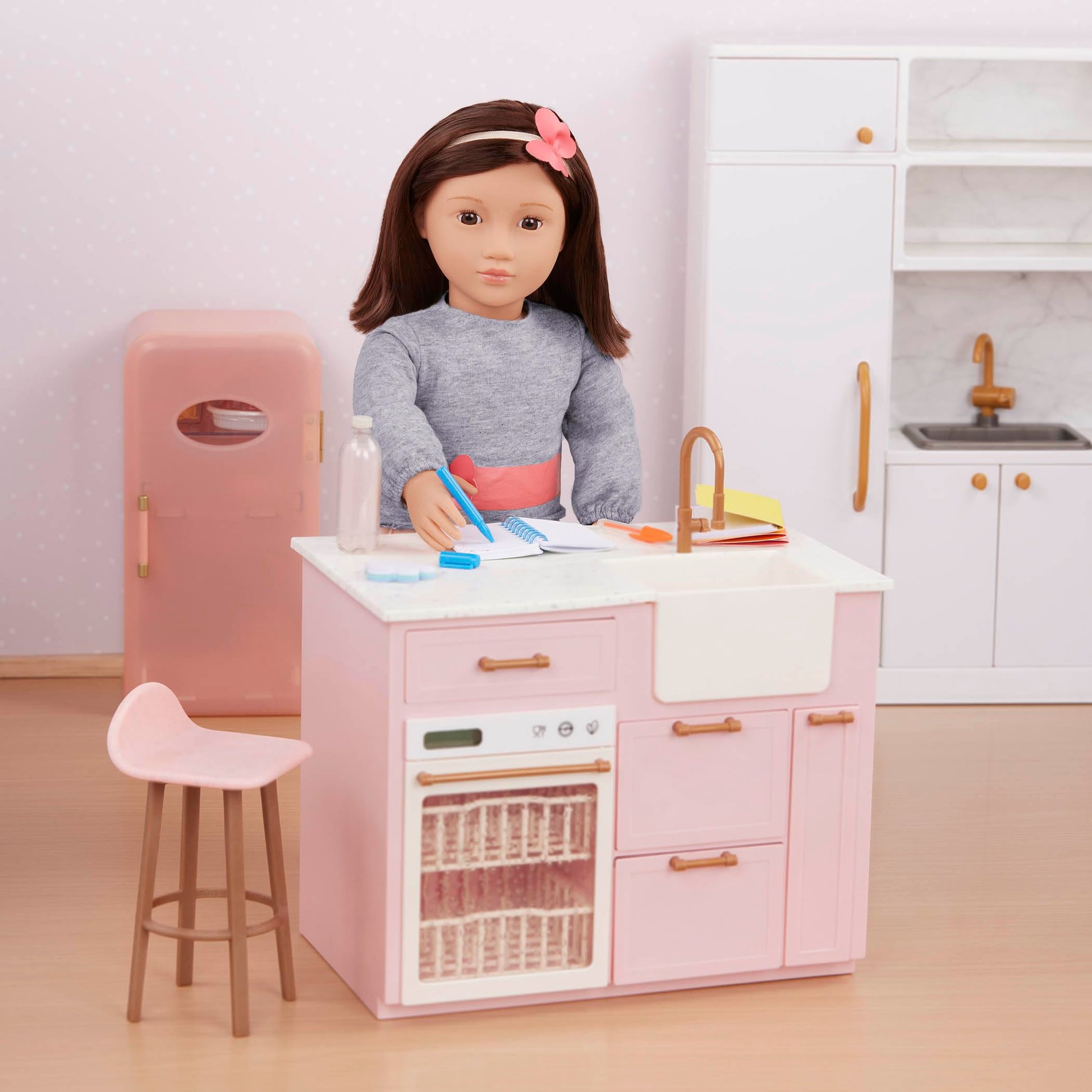 Our Generation pink mini fridge with play food accessories for 46cm dolls, showcasing realistic design and vibrant colors.