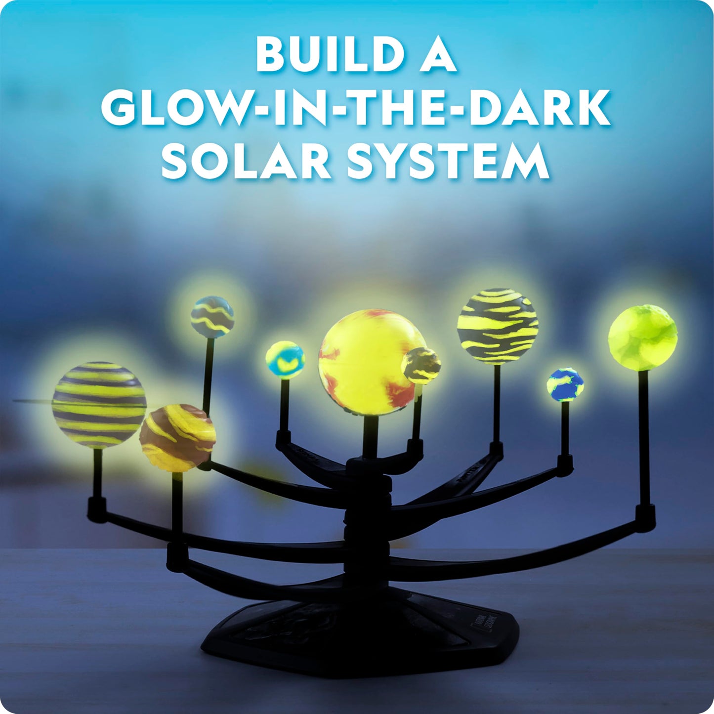 Blue Marble National Geographic glow-in-the-dark solar system model kit for kids, featuring 3D planets with movable arms.