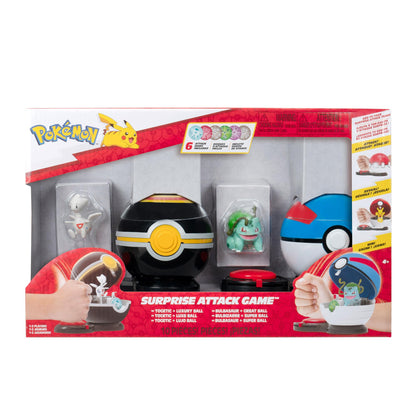 Pokémon Surprise Attack Game featuring Pikachu, Charmander, Grookey, and accessories including Poké Balls and attack discs.