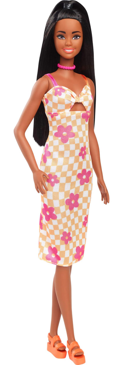 Barbie Fashionistas Doll #233 with black hair wearing checkered orange and pink flower midi dress, necklace, and sandals.