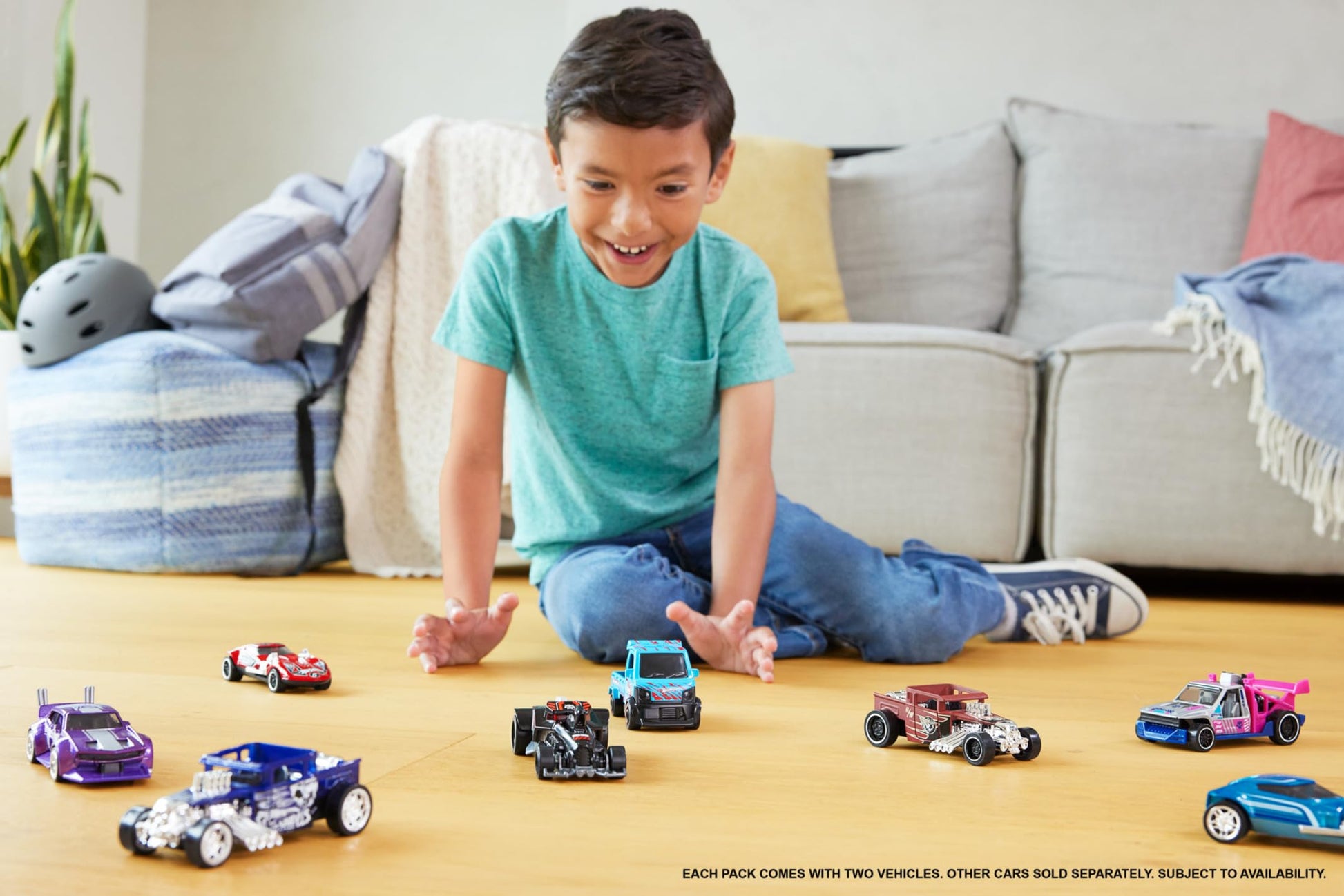 Set of 2 Hot Wheels pull-back speeders in assorted styles, showcasing detailed designs and movable parts in 1:43 scale.