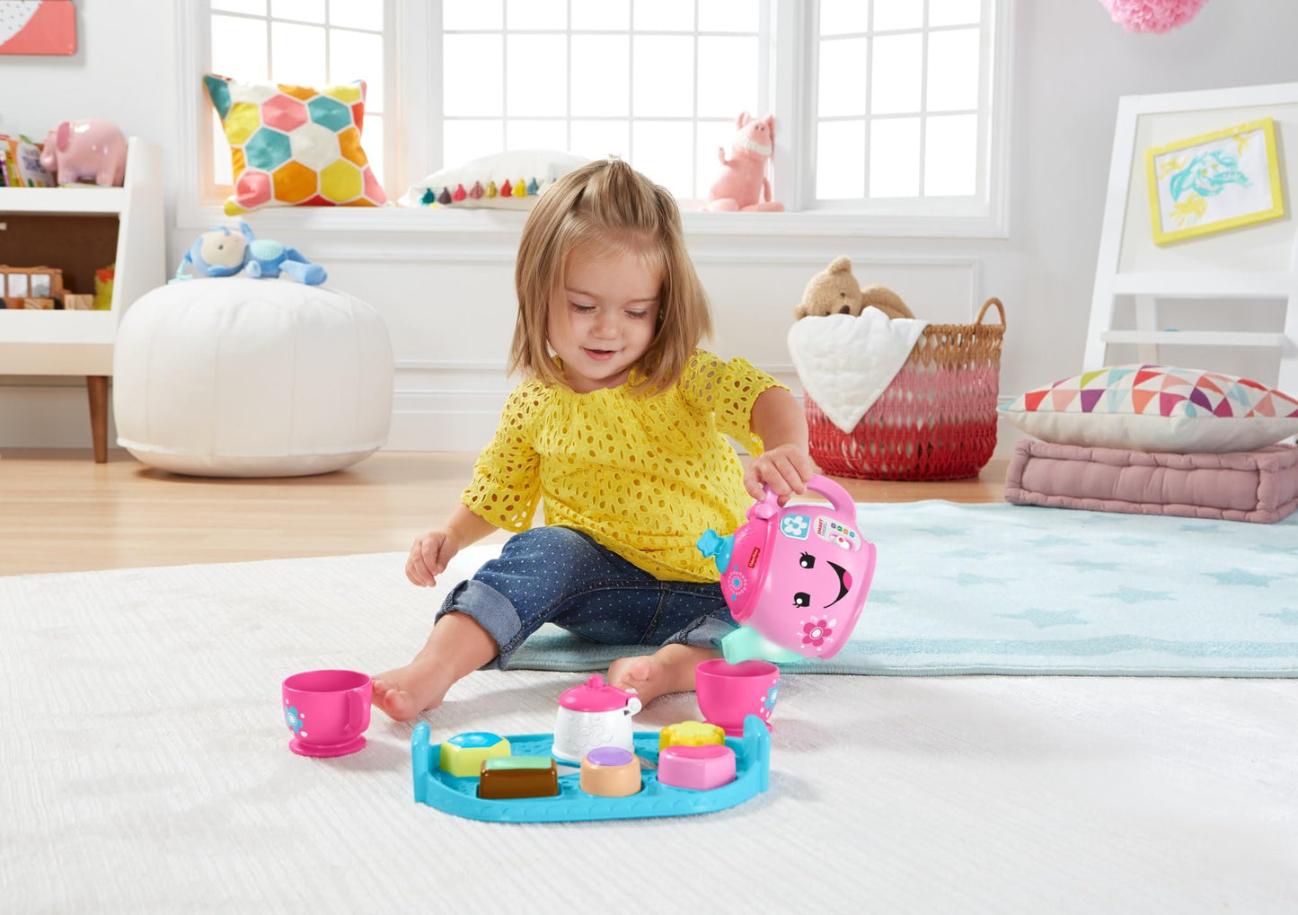 Fisher-Price Laugh & Learn Sweet Manners Tea Set for toddlers, featuring colorful cups, teapot, and play food with lights and sounds.