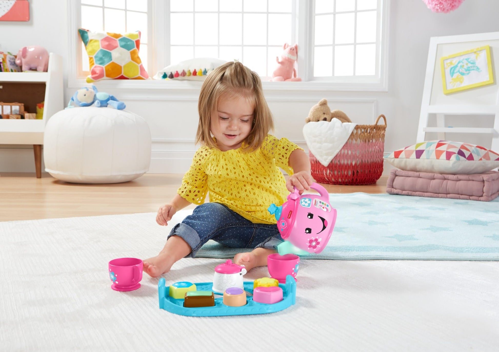 Fisher-Price Laugh & Learn Sweet Manners Tea Set for toddlers, featuring colorful cups, teapot, and play food with lights and sounds.