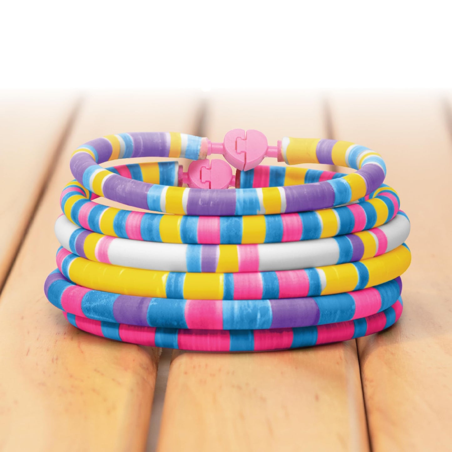 FabLab Colour Spin Bracelet Maker kit showing colorful bracelets created with the no-threading jewelry making set for kids.