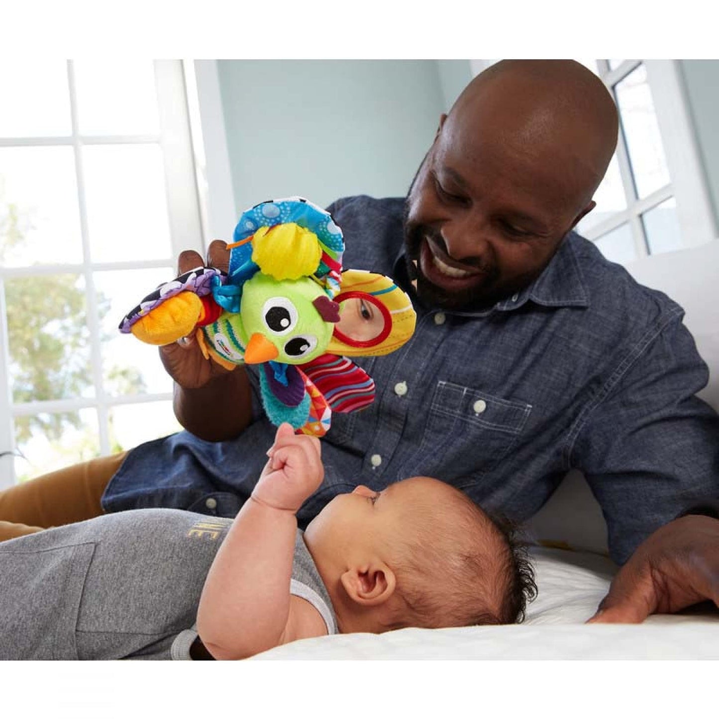 LAMAZE Jacques the Peacock clip-on baby toy for pram and pushchair, sensory toy for newborns 0-6 months, colorful and soft.