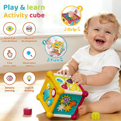 Colorful Imagibox activity cube baby toy with shape sorter, music busy board, pop-up bubbles, and sensory features for infants 6-12 months.