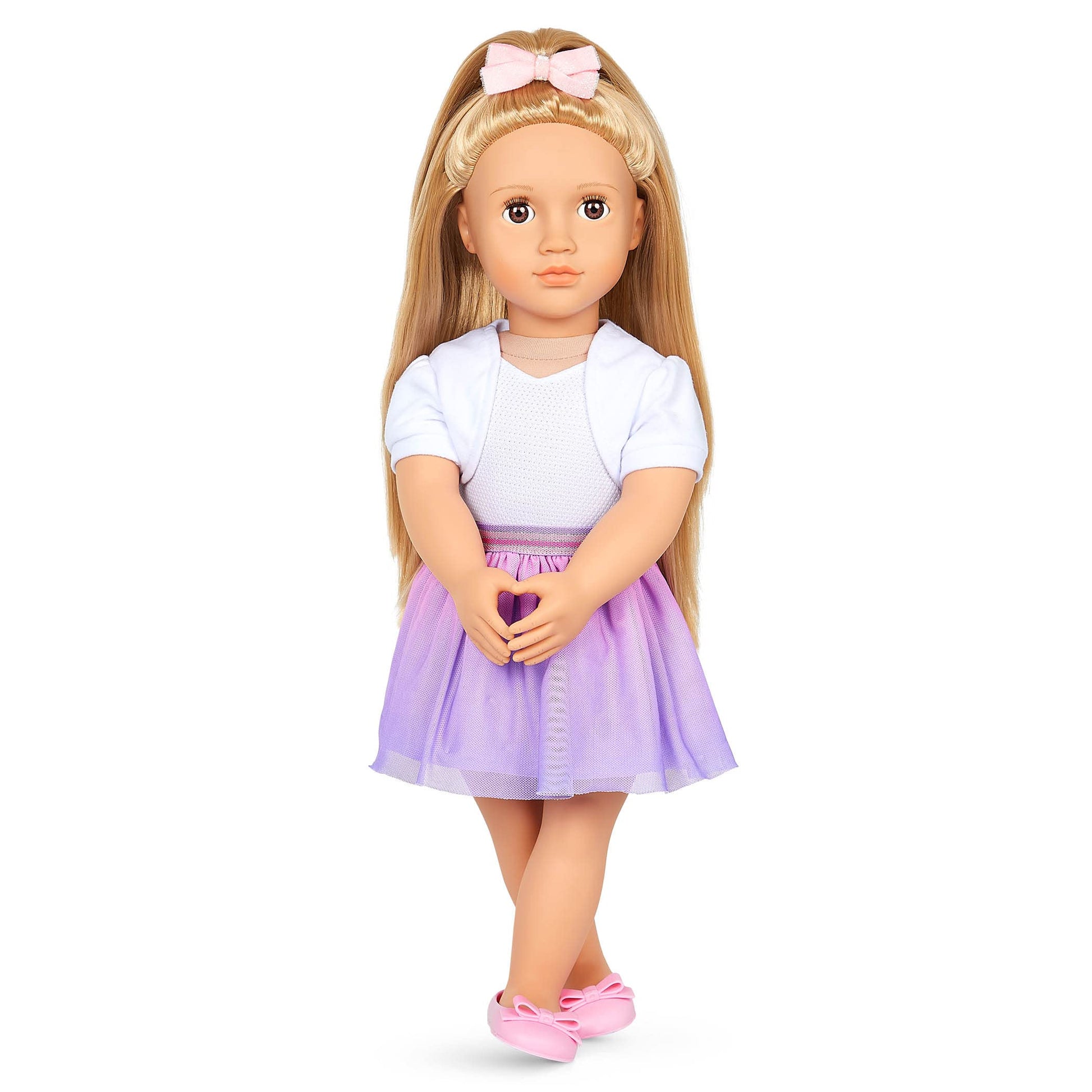 Our Generation Thea doll with blonde hair and hazel eyes, featuring bow-themed outfits and styling accessories in a gift box.