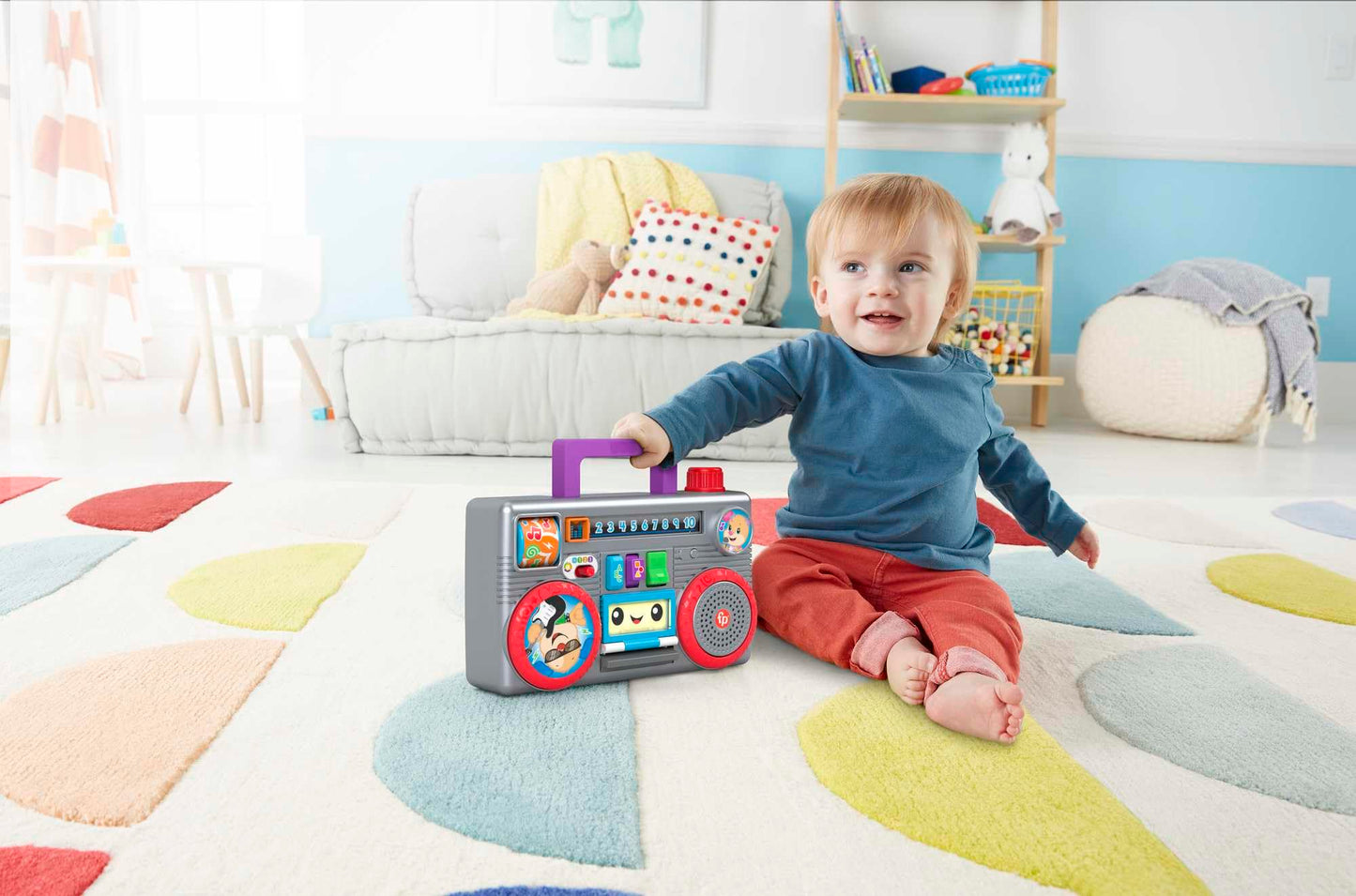Fisher-Price Laugh & Learn Busy Boombox infant toy with colorful buttons and musical features, designed for babies and toddlers.