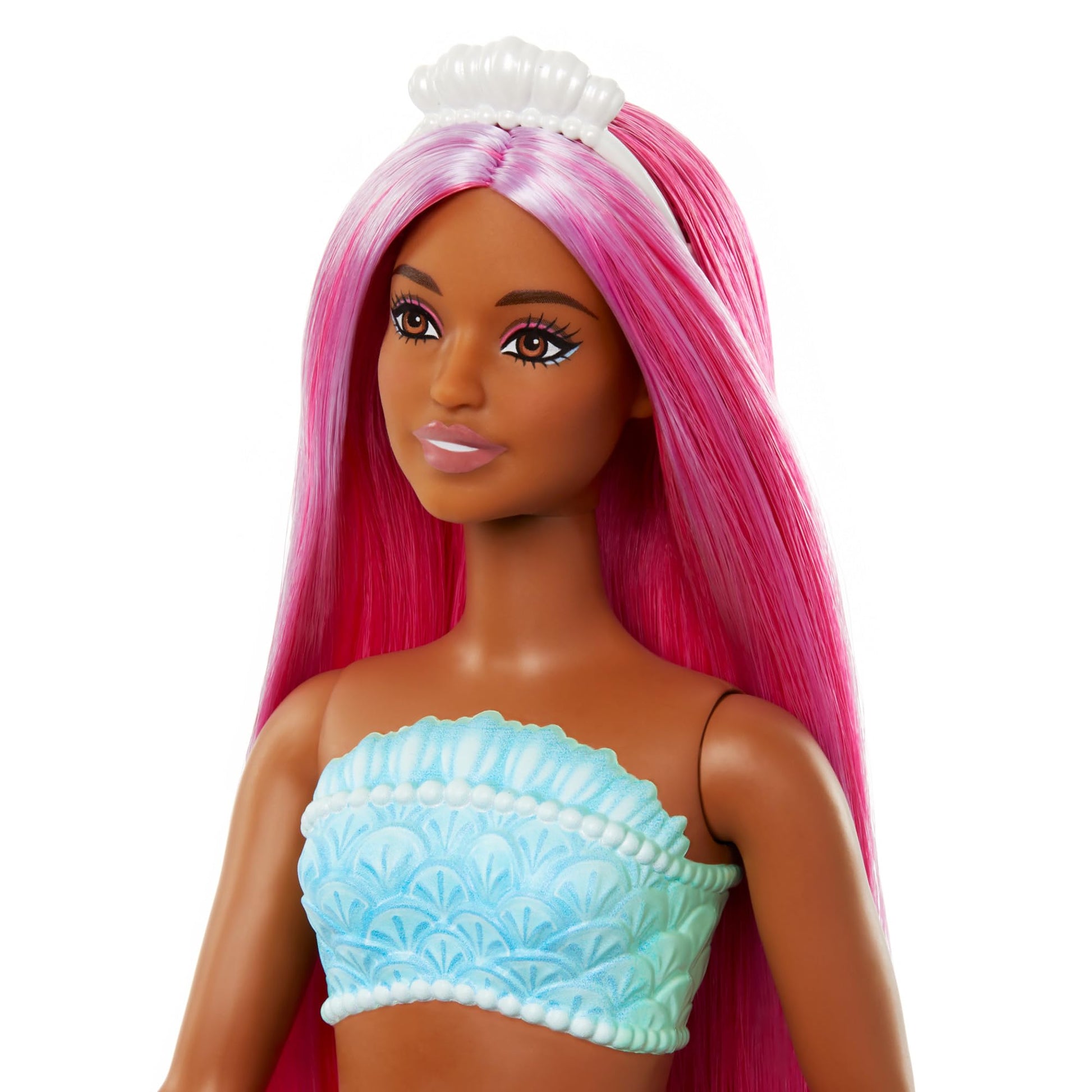 Barbie mermaid doll with magenta hair, shell bodice, and tropical red tail, featuring a curvy body type and headband accessory.