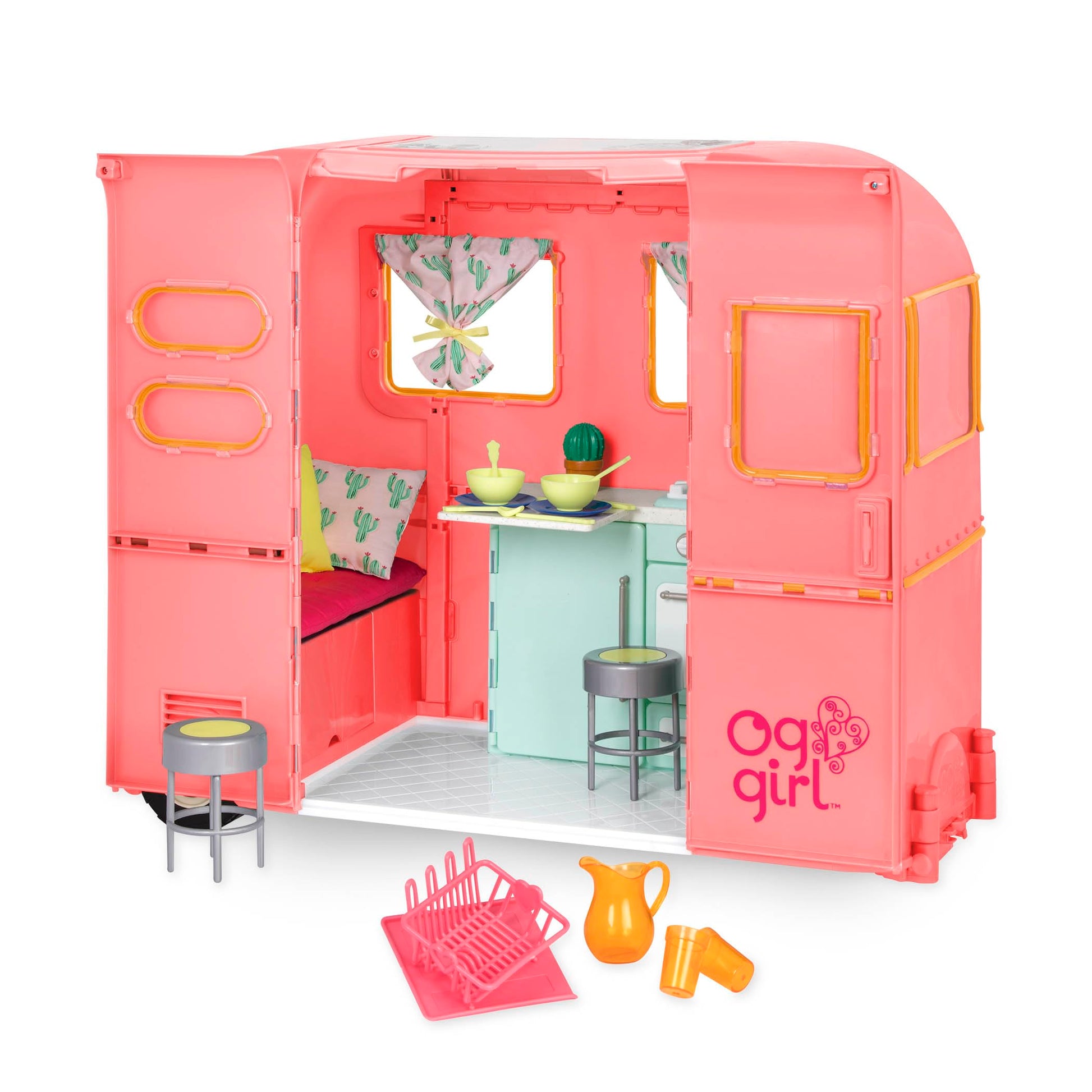 Our Generation pink camping trailer with kitchen accessories for 18-inch dolls, designed for pretend play.