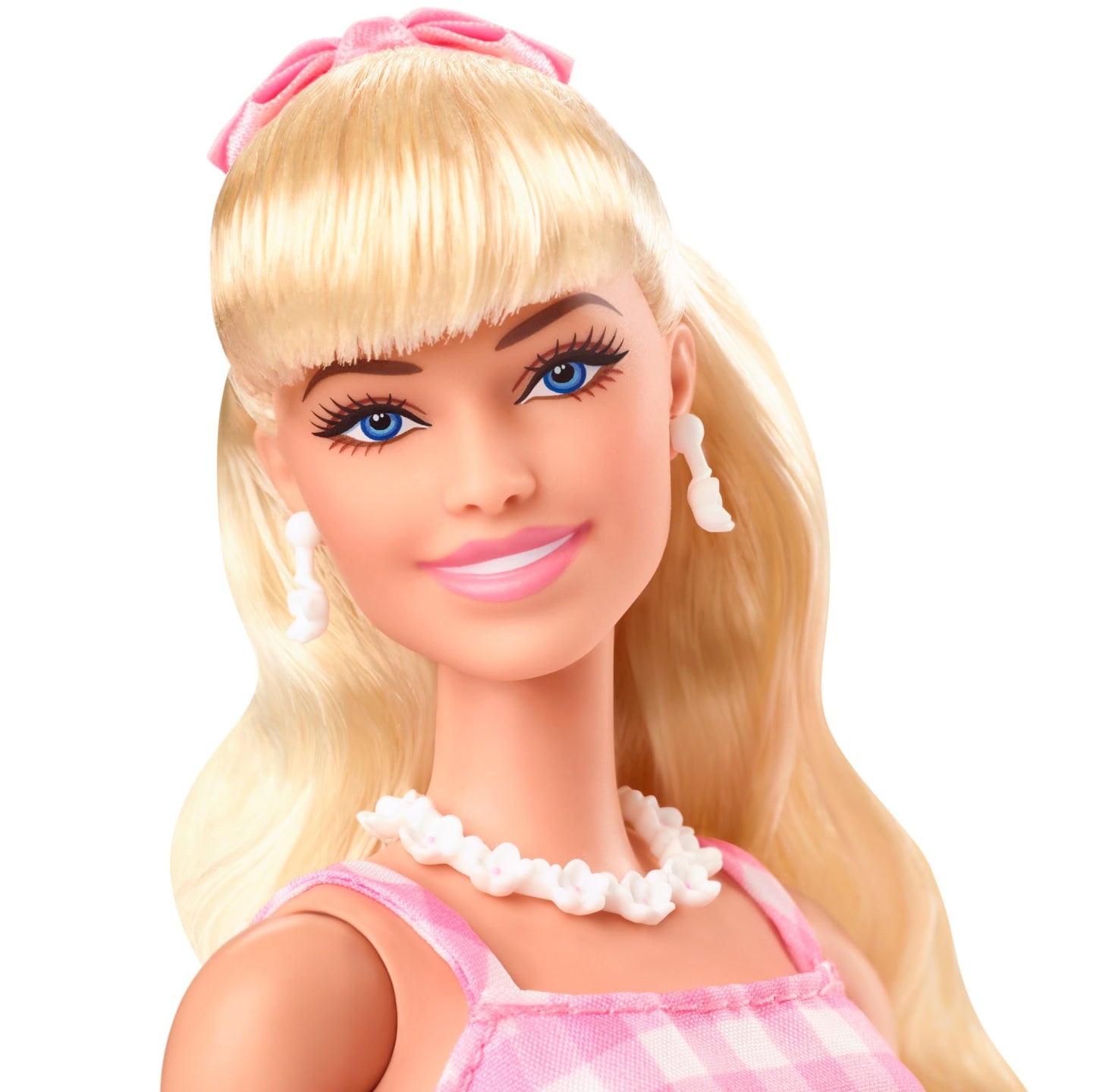 Barbie doll inspired by Margot Robbie wearing a pink and white gingham dress and daisy chain necklace, suitable for ages 3 and up.