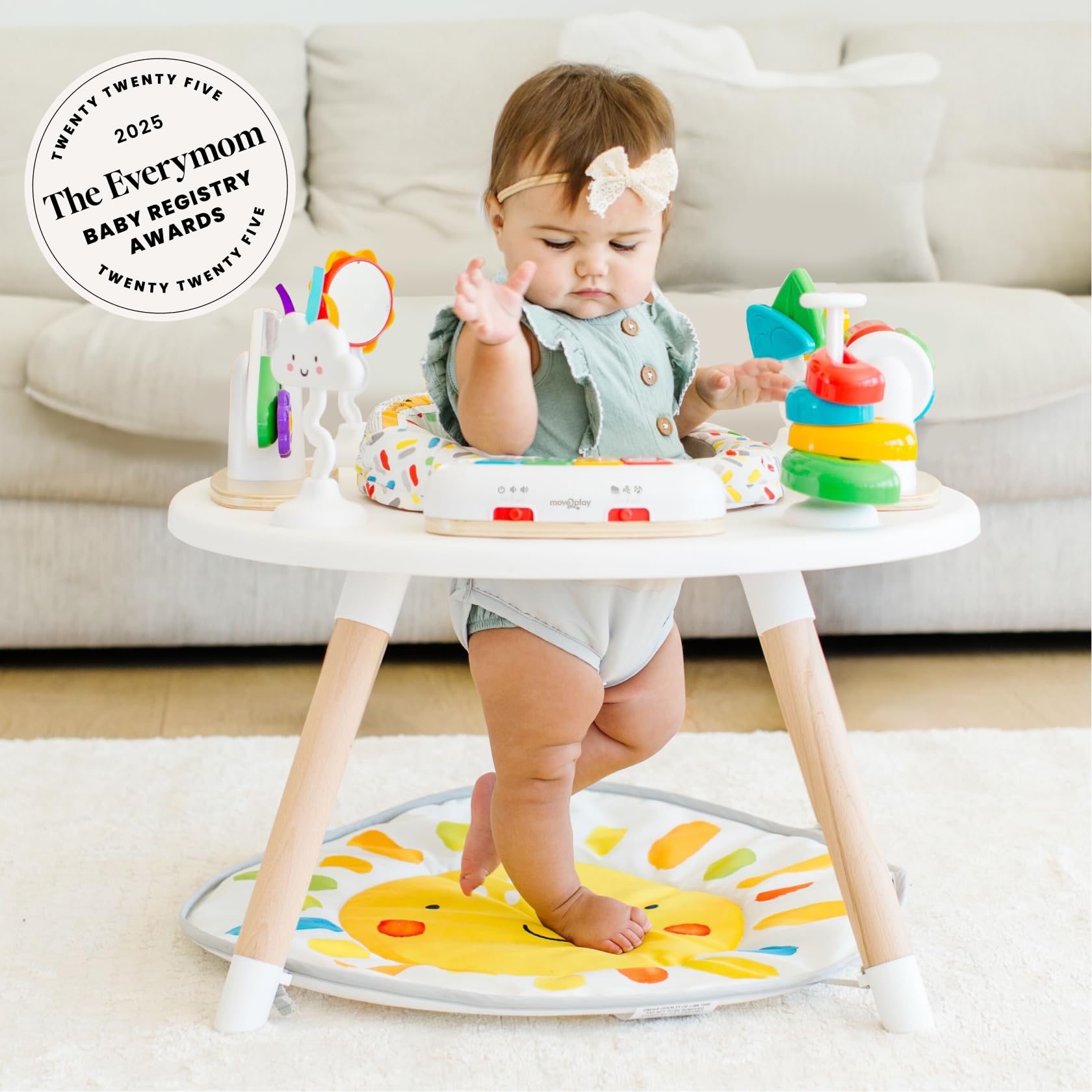 Move2Play 4-in-1 baby activity center with colorful toys on sun mat, featuring tummy time and jumper functions for 3-6+ months.
