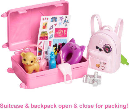 Barbie Malibu doll with blonde hair in travel set, includes suitcase, puppy, and 10+ accessories for imaginative play.