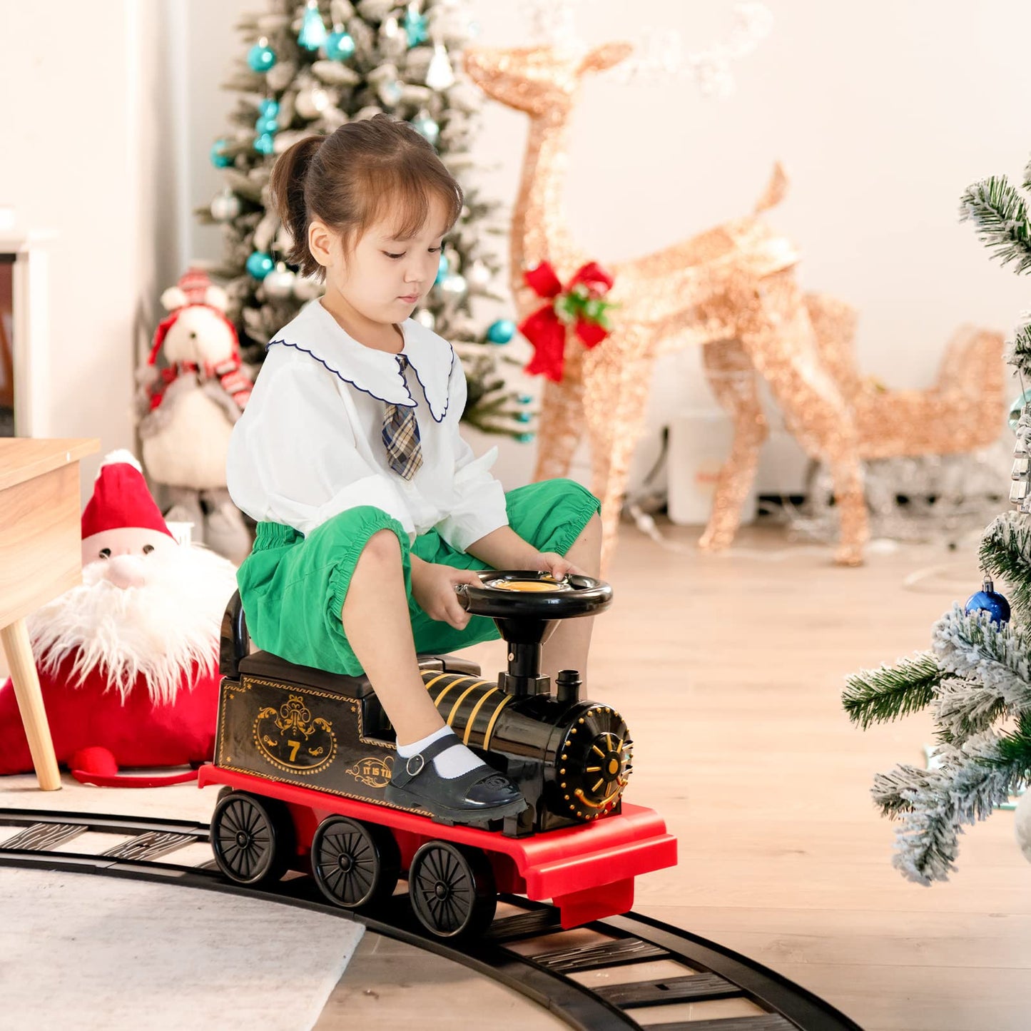 COSTWAY kids electric ride-on train in black with flashing lights, music, storage seat, tracks, and 6V battery for toddlers.