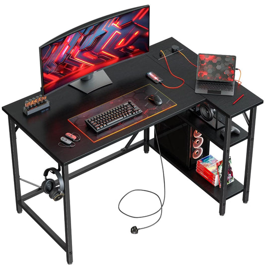 DOMSHOCT L Shaped Gaming Desk with Power Outlets, 100x70cm Small Corner Computer Table with Large Reversible Storage Shelves, Home Office PC Workstation with Hooks for Writing Study, Black