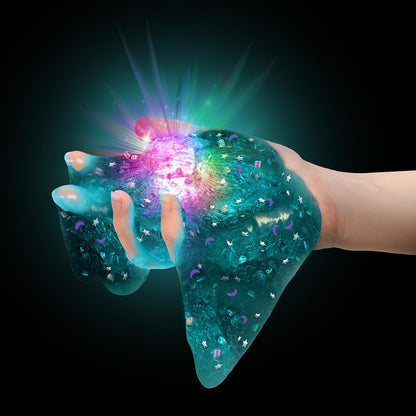 Colorful cosmic slime set by Canal Toys featuring light-up slime, decorations, and color-changing LED for sensory play.