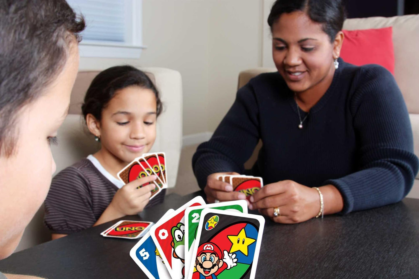 Fisher-Price UNO Super Mario card game with animated character images, 112 collectible cards for kids aged 7 and up.