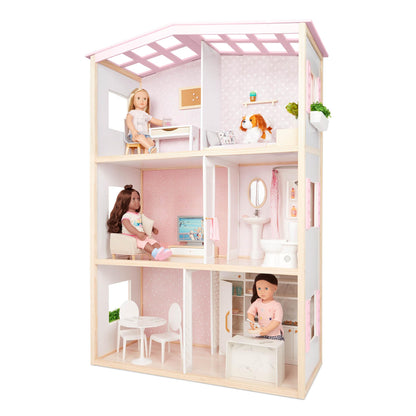 Our Generation dollhouse playset featuring movable furniture for bedroom, kitchen, and bathroom in a cozy setting.
