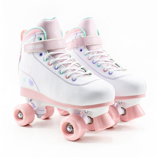 Cream Kids adjustable quad roller skates with white and pink hearts, featuring four wheels for balance and beginner-friendly fit.