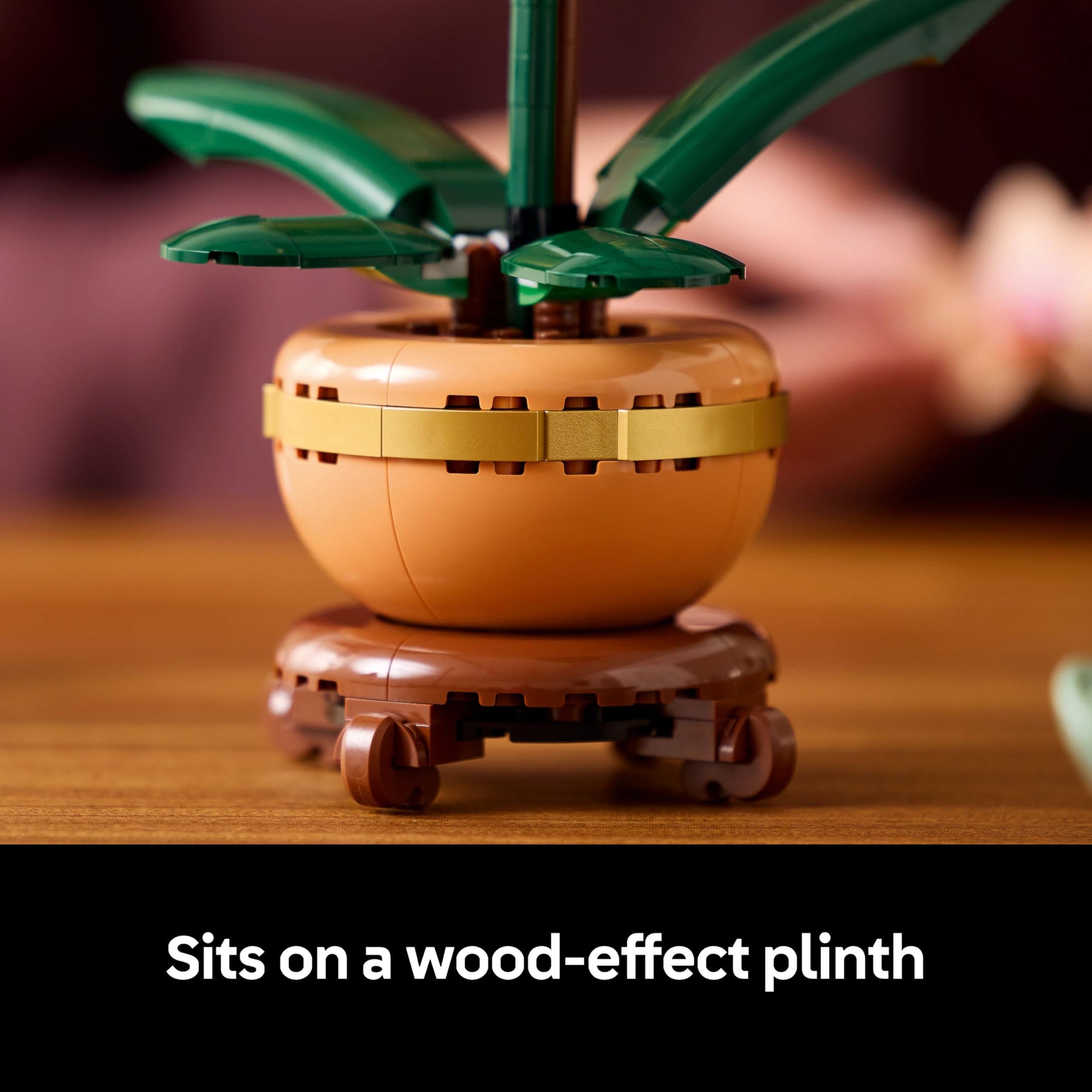 LEGO Botanicals Mini Orchid set in a terracotta pot, showcasing vibrant artificial flowers for indoor decor.