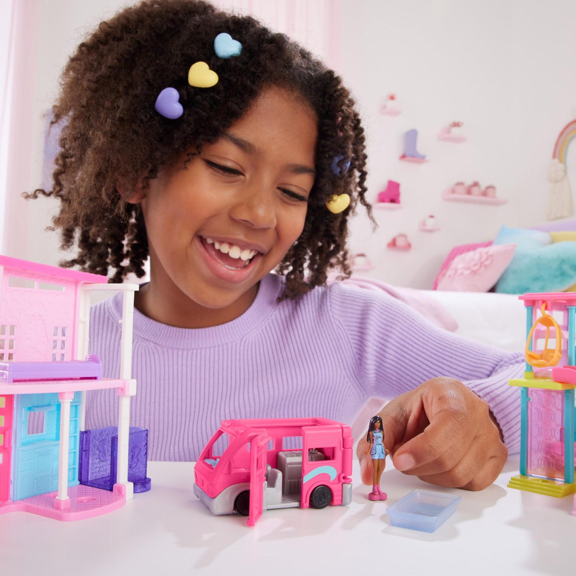 Mini BarbieLand doll and DreamCamper toy set with working doors and color-change pool, includes 1.5-inch Barbie doll and vehicle