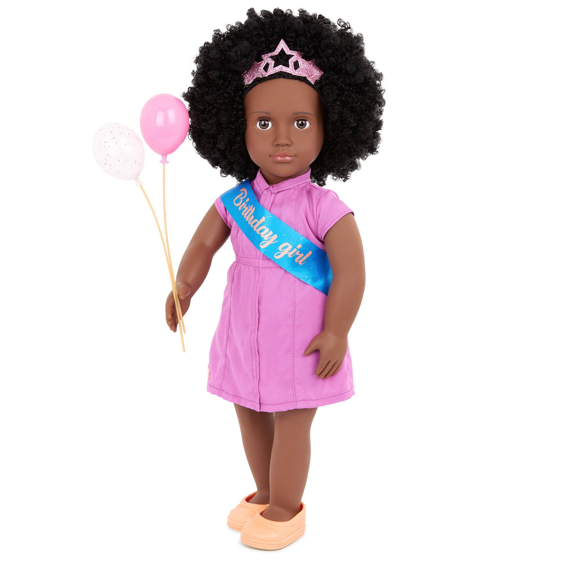 Our Generation 18-inch Khelani doll dressed for a birthday party with colorful accessories and festive decorations.