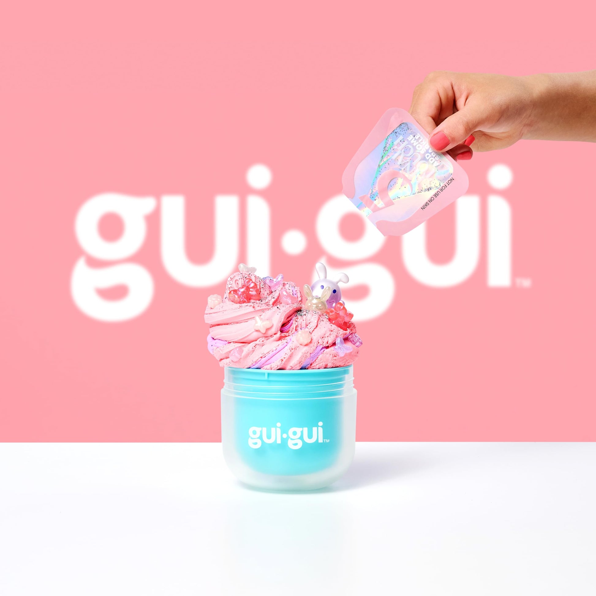 Gui Gui glossy slime in vibrant colors with scented and textured varieties, perfect for kids and teens' slime collection.