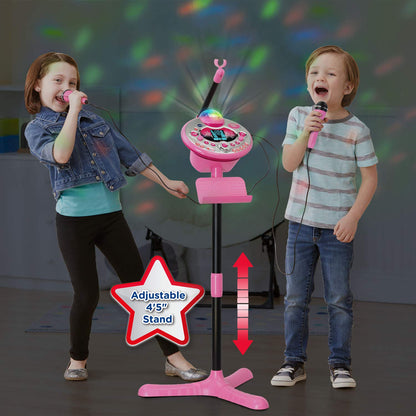 Pink VTech Kidi Star Karaoke System with two microphones, mic stand, and AC adapter, designed for kids' singing fun.