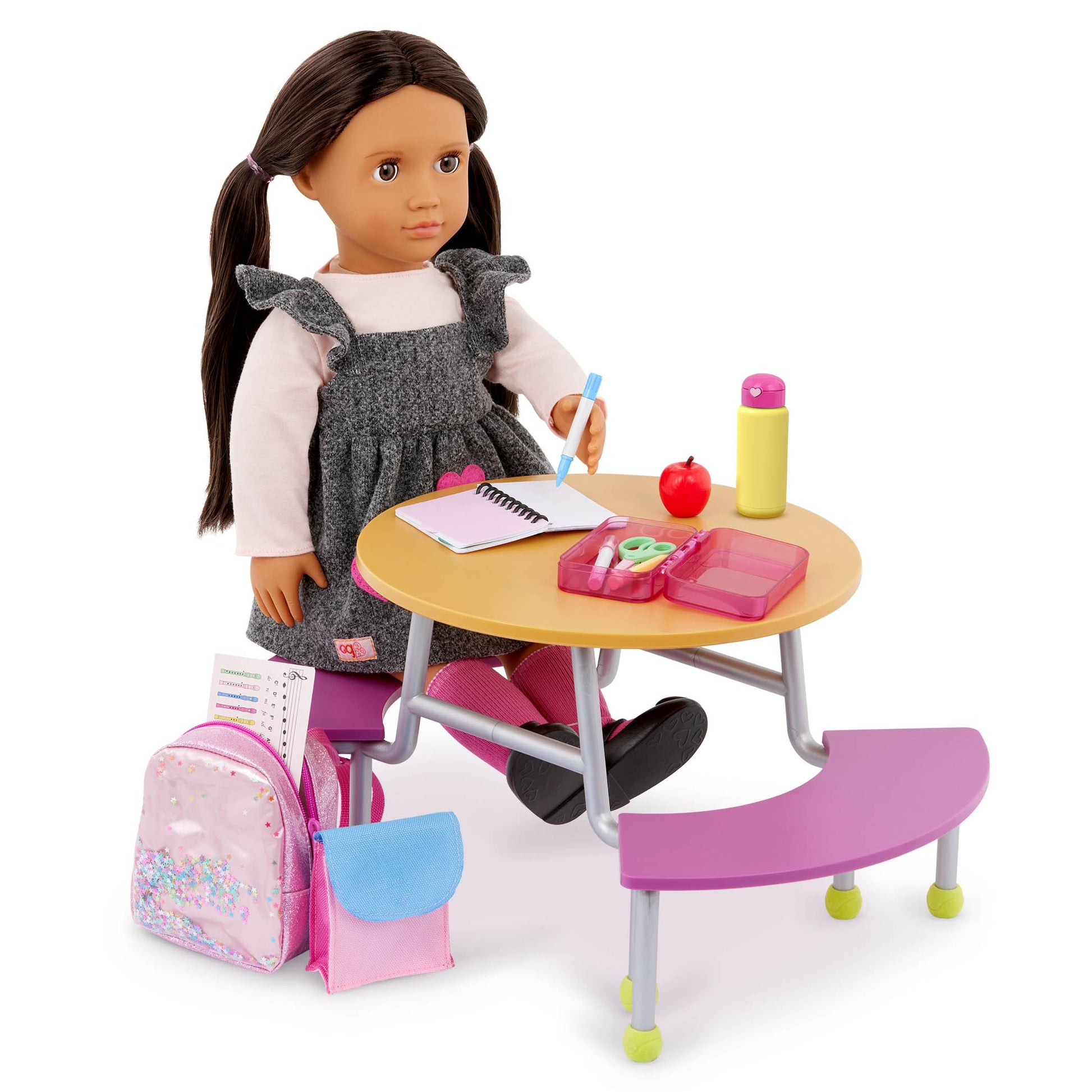 Our Generation 16-piece backpack and school supplies set for 18-inch dolls, featuring colorful accessories for imaginative play.