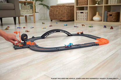 Hot Wheels City Track Pack with 10 pieces, track base, various track pieces, and one car for kids 4 years and up.