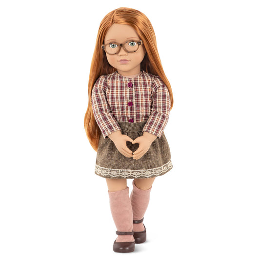 Our Generation April Doll with long red hair, wearing a stylish outfit, perfect for imaginative play and adventures.