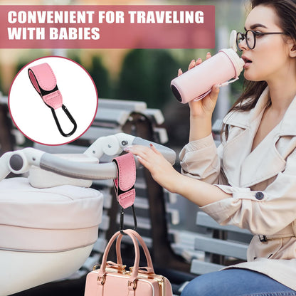 Pink leather buggy clips set with pram hook clips for bags, backpacks, and shopping carts, designed for pushchairs and strollers.