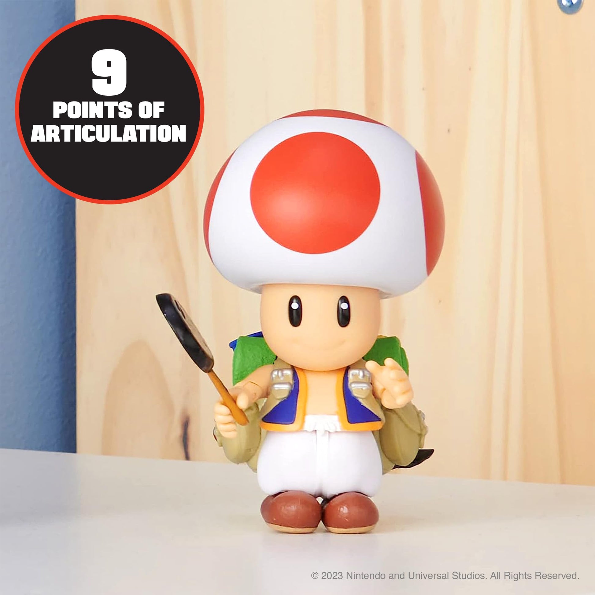 Super Mario Bros. Movie Nintendo Toad 5-inch action figure with frying pan accessory, detailed plastic collectible toy.