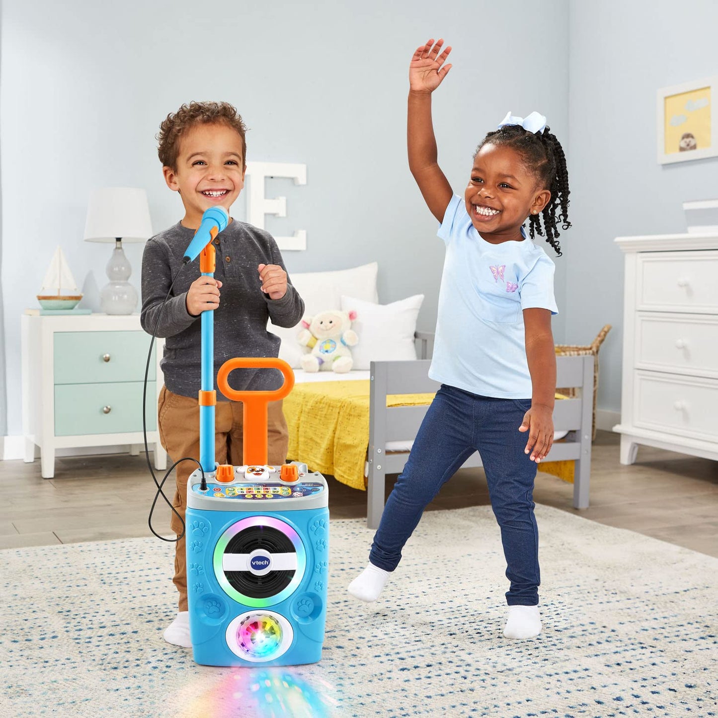 VTech Kidi Superstar Jr. karaoke machine with colorful microphone and built-in music buttons for kids' singing fun.
