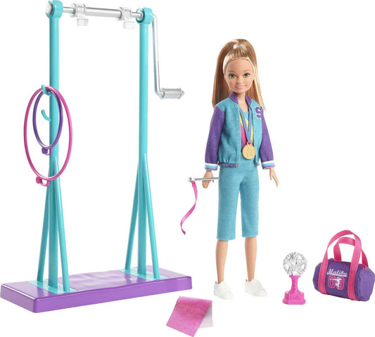 Barbie Team Stacie Doll with gymnastics playset, spinning bar, and 7 colorful themed accessories, in a vibrant scene.