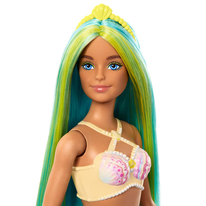 Barbie mermaid doll with two-tone blue and yellow hair, turquoise tail, and shell bodice, wearing a headband accessory.