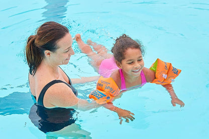 Zoggs orange kid's float bands, swimming armbands for ages 1-3 years, featuring a vibrant design for water safety.