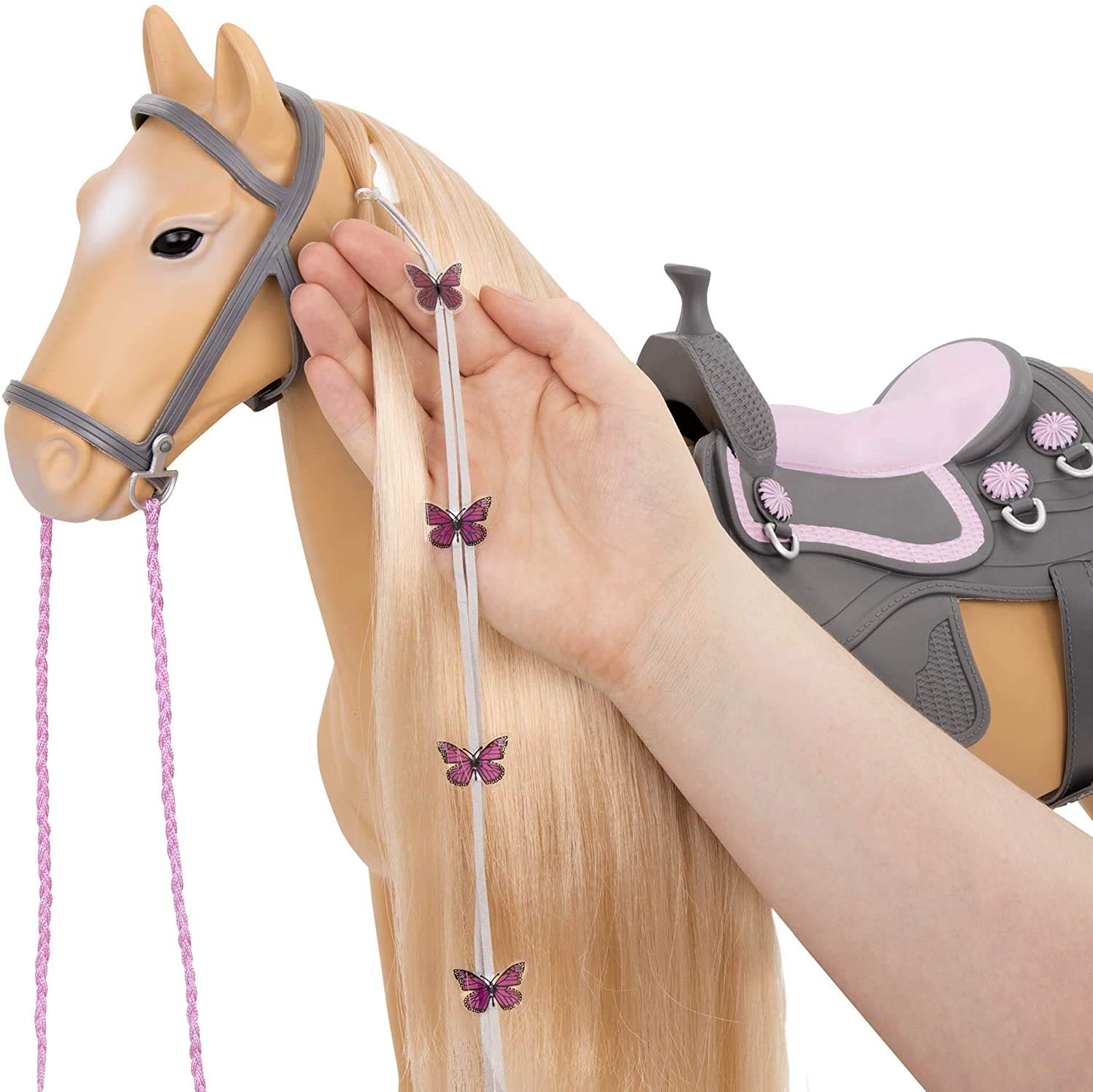 Our Generation Palomino Pain Hair Kids Toy Play Horse with saddle, bridle, hair brush, ribbons, and green hair extension.