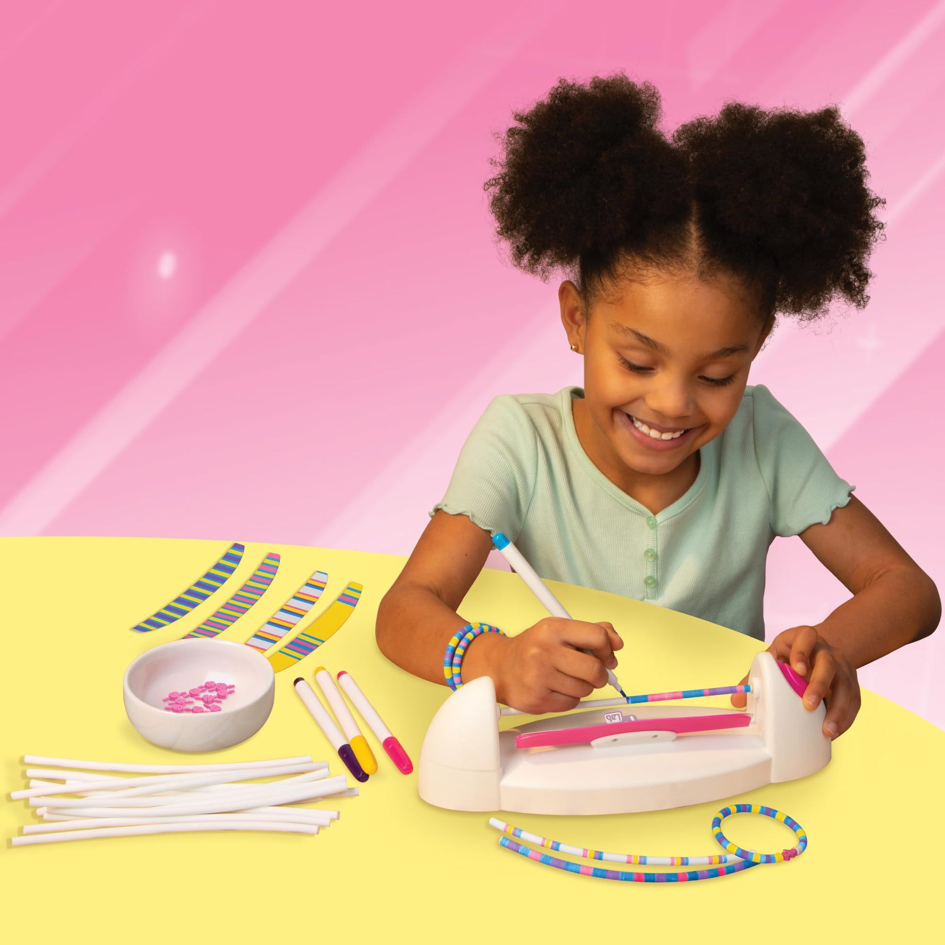 FabLab Colour Spin Bracelet Maker for kids, showing colorful bracelets created with this no-thread jewelry making kit.