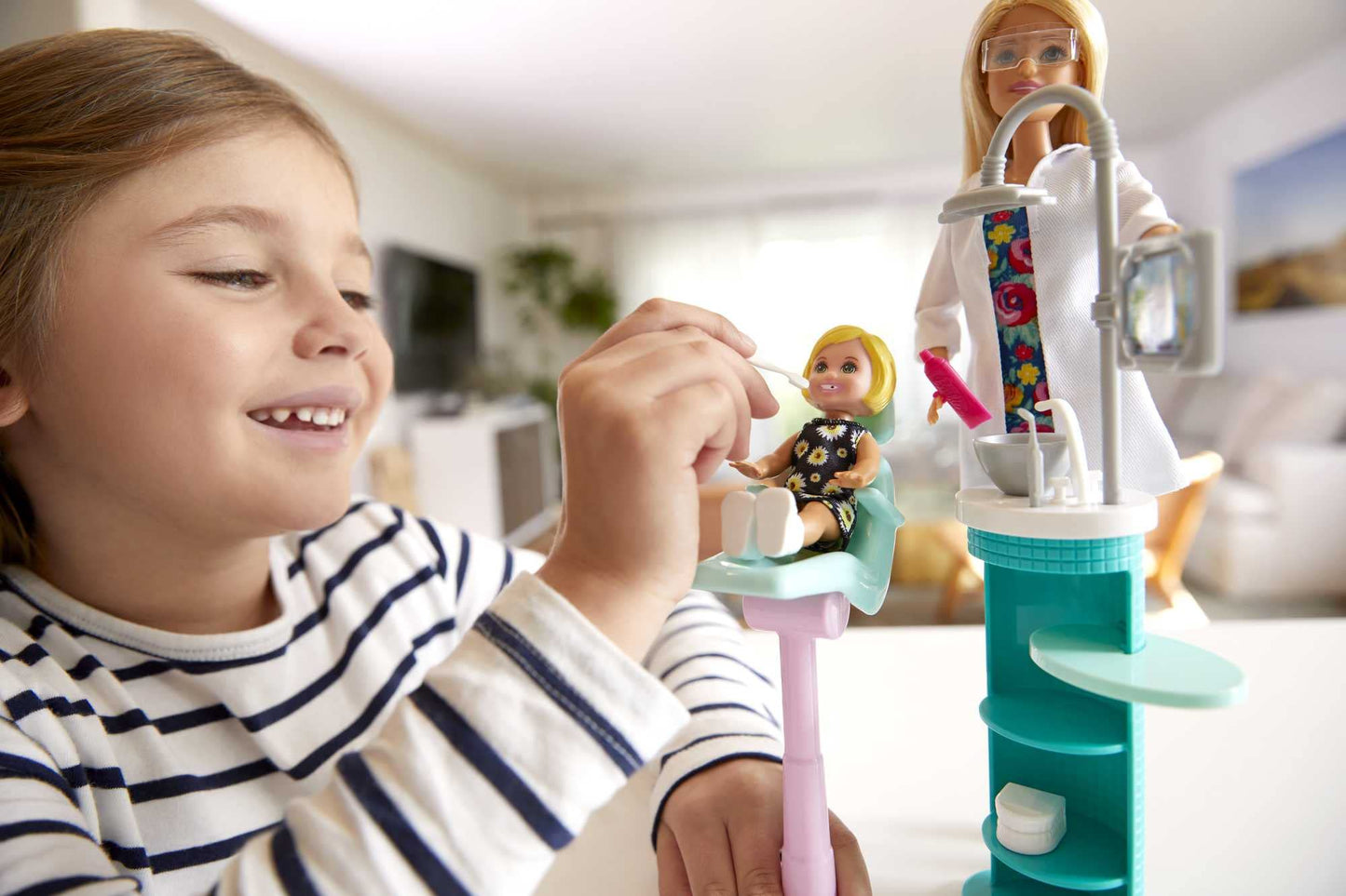 Barbie FXP16 Dentist doll and playset with colorful accessories, featuring a Barbie dentist figure and dental tools.