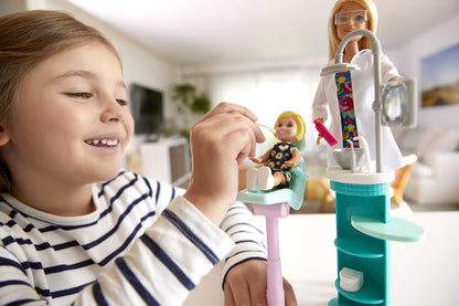 Barbie FXP16 Dentist doll and playset with colorful accessories, featuring a Barbie dentist figure and dental tools.