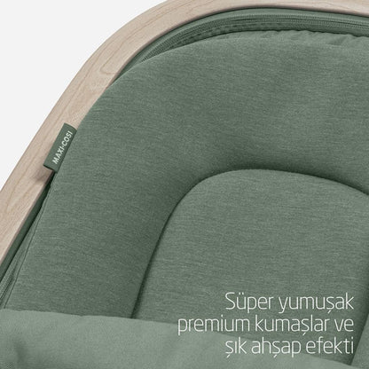 Maxi-COSI Kori 2-in-1 ergonomic baby bouncer chair with toy arch, adjustable recline, lightweight design, and newborn pillow for infants.