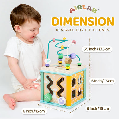 Airlab wooden activity cube toy for babies and toddlers with bead maze, shape sorter, and sensory features for early learning.